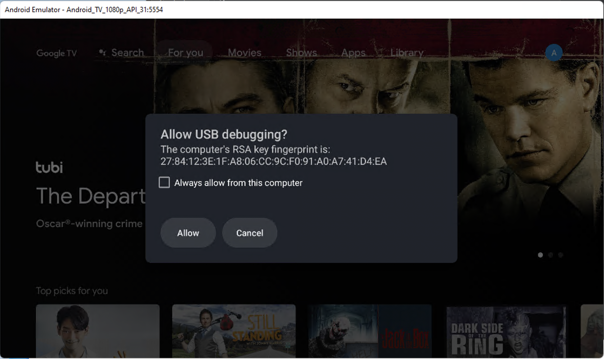 Android TV emulator showing a debug authorization dialog